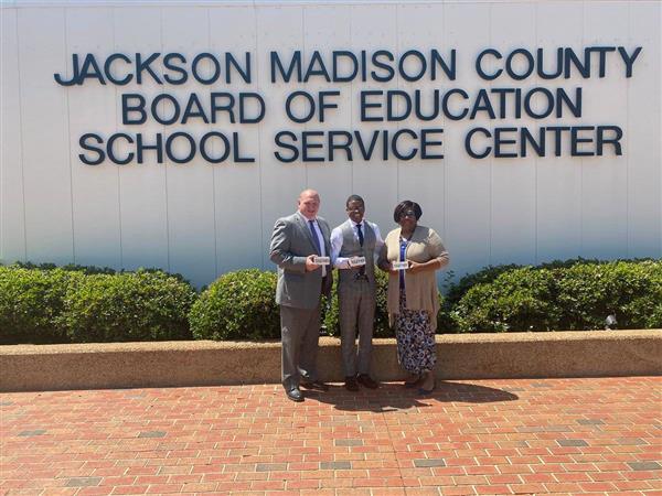 Deputy superintendents pose for a photo with Dr. Marlon King 